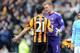 HULL, ENGLAND - MARCH 15: Shane Long (L) of Hull City and Joe Hart of Manchester City have words with one another at the end of the game during the Barclays Premier League match between Hull City and Manchester City at the KC Stadium on March 15, 2014 in