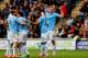 HULL, ENGLAND - MARCH 15: Edin Dzeko (R) of Manchester City celerates with teammates after scoring his team's second goal during the Barclays Premier league match between Hull City and Manchester City at KC Stadium on March 15, 2014 in Hull, England. (P