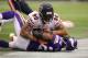 MINNEAPOLIS, MN - DECEMBER 1: Adrian Peterson #28 of the Minnesota Vikings is tackled by Julius Peppers #90 of the Chicago Bears on December 1, 2013 at Mall of America Field at the Hubert Humphrey Metrodome in Minneapolis, Minnesota. (Photo by Adam Bettc