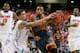 ATLANTA, GA - MARCH 15: Jordan McRae #52 of the Tennessee Volunteers drives with the ball against Scottie Wilbekin #5 of the Florida Gators during the semifinals of the SEC Men's Basketball Tournament at Georgia Dome on March 15, 2014 in Atlanta, Georgia