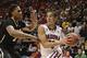 Mar 14, 2014; Las Vegas, NV, USA; Arizona Wildcats guard Nick Johnson (13) drives to the basket against Colorado Buffaloes forward Xavier Johnson (2) during the first half in the semifinals of the Pac-12 Conference college basketball tournament at MGM Gra