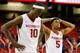 ATLANTA, GA - MARCH 13: Anthlon Bell #5 and Bobby Portis #10 of the Arkansas Razorbacks walk off the court after their 71-69 loss to the South Carolina Gamecocks during the second round of the SEC Men's Basketball Tournament at Georgia Dome on March 13,