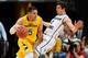 LAS VEGAS, NV - MARCH 10: Matt Glover #5 of the San Francisco Dons drives against Matt Carlino #2 of the Brigham Young Cougars during a semifinal game of the West Coast Conference Basketball tournament at the Orleans Arena on March 10, 2014 in Las Vegas,