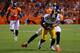 DENVER, CO - SEPTEMBER 09: Wide receiver Emmanuel Sanders #88 of the Pittsburgh Steelers makes a 17 yard reception to the Denver 4 yard line as defensive back Tracy Porter #22 of the Denver Broncos makes the tackle at Sports Authority Field at Mile High