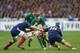 PARIS, FRANCE - MARCH 15: Jamie Heaslip of Ireland is tackled by Rabah Slimani (R) and Wenceslas Lauret (L) of France during the RBS Six Nations match between France and Ireland at Stade de France on March 15, 2014 in Paris, France. (Photo by Paul Gilha