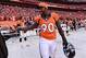 January 19, 2014; Denver, CO, USA; Denver Broncos defensive end Shaun Phillips (90) following the 26-16 victory against the New England Patriots in the 2013 AFC Championship football game at Sports Authority Field at Mile High. Mandatory Credit: Ron Cheno