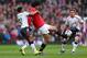 MANCHESTER, ENGLAND - MARCH 16: Marouane Fellaini of Manchester United tangles with Raheem Sterling of Liverpool during the Barclays Premier League match between Manchester United and Liverpool at Old Trafford on March 16, 2014 in Manchester, England. (