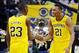 Mar 15, 2014; Indianapolis, IN, USA; Michigan Wolverines guard Caris LeVert (23) and guard Zak Irvin (21) celebrate during the semifinals of the Big Ten college basketball tournament against the Ohio State Buckeyes at Bankers Life Fieldhouse. Michigan won
