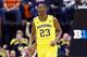 INDIANAPOLIS, IN - MARCH 14: Caris LeVert #23 of the Michigan Wolverines celebrates in the game against the Illinois Fighting Illini during the Quarterfinals of the Big Ten Basketball Tournament at Bankers Life Fieldhouse on March 14, 2014 in Indianapoli