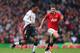 MANCHESTER, ENGLAND - MARCH 16: Daniel Sturridge of Liverpool competes with Michael Carrick of Manchester United during the Barclays Premier League match between Manchester United and Liverpool at Old Trafford on March 16, 2014 in Manchester, England. (