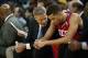 Feb 10, 2014; Oakland, CA, USA; Philadelphia 76ers head coach Brett Brown speaks to point guard Michael Carter-Williams (1) on the bench during the fourth quarter against the Golden State Warriors at Oracle Arena. The Golden State Warriors defeated the Ph