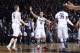CINCINNATI, OH - FEBRUARY 6: Shabazz Napier #13, Niels Giffey #5 and Amida Brimah #35 of the Connecticut Huskies celebrate against the Cincinnati Bearcats during the first half of the game against at Fifth Third Arena on February 6, 2014 in Cincinnati, O
