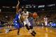 ST. LOUIS, MO - MARCH 9: Cleanthony Early #11 of the Wichita State Shockers looks to get past Khristian Smith #32 of the Indiana State Sycamores during the MVC Basketball Tournament Championship game at the Scottrade Center on March 9, 2014 in St. Louis,