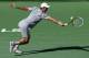 INDIAN WELLS, CA - MARCH 16: Novak Djokovic of Serbia hits a return to Roger Federer of Switzerland during the men's final of the BNP Paribas Open at Indian Wells Tennis Garden on March 15, 2014 in Indian Wells, California. Pennetta won 6-2, 6-1. (Photo