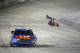 BRISTOL, TN - MARCH 16: Carl Edwards, driver of the #99 Kellogg's/Frosted Flakes Ford, celebrates with a backflip after winning the NASCAR Sprint Cup Series Food City 500 at Bristol Motor Speedway on March 16, 2014 in Bristol, Tennessee. (Photo by Jonat