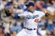 Mar 13, 2014; Phoenix, AZ, USA; Los Angeles Dodgers starting pitcher Paul Maholm (46) pitches against the Cincinnati Reds in the first inning at Camelback Ranch. Mandatory Credit: Joe Camporeale-USA TODAY Sports