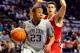 UNIVERSITY PARK, PA - MARCH 02: Tim Frazier #23 of the Penn State Nittany Lions drives to the basket around Bronson Koenig #24 of the Wisconsin Badgers during the first half at the Bryce Jordan Center on March 2, 2014 in University Park, Pennsylvania. (