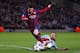 MANCHESTER, ENGLAND - FEBRUARY 18: Martin Demichelis of Manchester City fouls Lionel Messi of Barcelona to concede a penalty and is subsequently sent off during the UEFA Champions League Round of 16 first leg match between Manchester City and Barcelona a