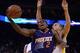 December 27, 2013; Oakland, CA, USA; Phoenix Suns point guard Eric Bledsoe (2) drives to the basket against Golden State Warriors point guard Stephen Curry (30) during the first quarter at Oracle Arena. Mandatory Credit: Kyle Terada-USA TODAY Sports