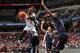 MEMPHIS, TN - MARCH 15: Russ Smith #2 of the Louisville Cardinals drives to the basket against Amida Brimah #35 of the Connecticut Huskies during the Championship of the American Athletic Conference Tournament at FedExForum on March 15, 2014 in Memphis, T