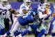 EAST RUTHERFORD, NJ - NOVEMBER 24: Tony Romo #9 of the Dallas Cowboys is sacked by Linval Joseph #97 of the New York Giants at MetLife Stadium on November 24, 2013 in East Rutherford, New Jersey. (Photo by Elsa/Getty Images)