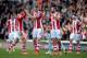 STOKE ON TRENT, ENGLAND - MARCH 15: Stoke City celebrate after the third goal during the Barclays Premier League match between Stoke City and West Ham United at the Britannia Stadium on March 15, 2014 in Stoke on Trent, England. (Photo by Ross Kinnaird/