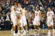 GREENSBORO, NC - MARCH 16: Joe Harris #12 is congratulate by Akil Mitchell #25 of the Virginia Cavaliers in the final minute of their victory over the Duke Blue Devils in the finals of the 2014 Men's ACC Basketball Tournament at Greensboro Coliseum on Ma