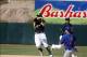 Mar 17, 2014; Phoenix, AZ, USA; Oakland Athletics second baseman Eric Sogard (28) turns the double play while avoiding Chicago Cubs center fielder Brett Jackson (7) in the fifth inning at Phoenix Municipal Stadium. Mandatory Credit: Rick Scuteri-USA TODAY
