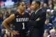 Jan 8, 2014; Storrs, CT, USA; Harvard Crimson head coach Tommy Amaker talks to guard Siyani Chambers (1) from the sideline as they take on the Connecticut Huskies in the first half at Harry A. Gampel Pavilion. Mandatory Credit: David Butler II-USA TODAY S
