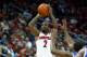 LOUISVILLE, KY - NOVEMBER 12: Russ Smith # 2 of the Louisville Cardinals shoots the ball during the game against the Hofstra Pride at KFC YUM! Center on November 12, 2013 in Louisville, Kentucky. (Photo by Andy Lyons/Getty Images)