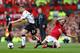 MANCHESTER, ENGLAND - MARCH 16: Jon Flanagan of Liverpool competes with Juan Mata of Manchester United during the Barclays Premier League match between Manchester United and Liverpool at Old Trafford on March 16, 2014 in Manchester, England. (Photo by A