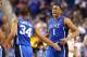 GREENSBORO, NC - MARCH 16: Jabari Parker #1 of the Duke Blue Devils is congratulated by Andre Dawkins #34 of the Duke Blue Devils during their game against the Virginia Cavaliers in the finals of the 2014 Men's ACC Basketball Tournament at Greensboro Col