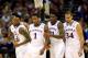 KANSAS CITY, MO - MARCH 13: Andrew Wiggins #22, Naadir Tharpe #10, Wayne Selden, Jr. #1, Jamari Traylor #31, and Perry Ellis #34 of the Kansas Jayhawks walk toward the bench during a timeout in the Big 12 Basketball Tournament quarterfinal game against t