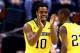 INDIANAPOLIS, IN - MARCH 16: Derrick Walton Jr. #10 of the Michigan Wolverines reacts against the Michigan State Spartans during the 2014 Big Ten Men's Championship at Bankers Life Fieldhouse on March 16, 2014 in Indianapolis, Indiana. (Photo by Andy Ly