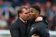 MANCHESTER, ENGLAND - MARCH 16: Liverpool Manager Brendan Rodgers congratulates Raheem Sterling at the end of the Barclays Premier League match between Manchester United and Liverpool at Old Trafford on March 16, 2014 in Manchester, England. (Photo by A
