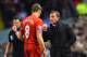 LIVERPOOL, ENGLAND - JANUARY 18: Brendan Rodgers, manager of Liverpool talks to Steven Gerrard during the Barclays Premier League match between Liverpool and Aston Villa at Anfield on January 18, 2014 in Liverpool, England. (Photo by Michael Regan/Getty