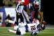FOXBORO, MA - NOVEMBER 24: Middle linebacker Brandon Spikes #55 of the New England Patriots tackles quarterback Peyton Manning #18 of the Denver Broncos during a game at Gillette Stadium on November 24, 2013 in Foxboro, Massachusetts. (Photo by Jared Wi