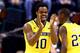 INDIANAPOLIS, IN - MARCH 16: Derrick Walton Jr. #10 of the Michigan Wolverines reacts against the Michigan State Spartans during the 2014 Big Ten Men's Championship at Bankers Life Fieldhouse on March 16, 2014 in Indianapolis, Indiana. (Photo by Andy Ly
