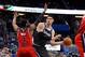 Mar 14, 2014; Orlando, FL, USA; Orlando Magic center Nikola Vucevic (9) passes the ball as Washington Wizards guard John Wall (2) defends during the second half at Amway Center. Washington Wizards defeated the Orlando Magic 105-101. Mandatory Credit: Kim