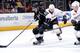 LOS ANGELES, CA - MARCH 15: Anze Kopitar #11 of the Los Angeles Kings skates with the puck against the Anaheim Ducks at Staples Center on March 15, 2014 in Los Angeles, California. (Photo by Andrew D. Bernstein/NHLI via Getty Images)