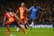 LONDON, ENGLAND - MARCH 18: Ramires of Chelsea is watched by Alex Telles (15) and Wesley Sneijder of Galatasaray (10) during the UEFA Champions League Round of 16 second leg match between Chelsea and Galatasaray AS at Stamford Bridge on March 18, 2014 in