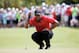 DORAL, FL - MARCH 09: Tiger Woods lines up a putt on the first green during the final round of the World Golf Championships-Cadillac Championship at Trump National Doral on March 9, 2014 in Doral, Florida. (Photo by Chris Trotman/Getty Images)