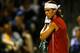 MIAMI - MARCH 28: Rafael Nadal of Spain wipes sweat off his face during his match against Roger Federer of Switzerland on March 28, 2004 during Nasdaq 100 Open at the Crandon Park Tennis Center on Key Biscayne in Miami, Florida. (Photo by Ezra Shaw/Gett