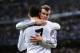 MADRID, SPAIN - MARCH 18: Cristiano Ronaldo of Real Madrid celebrates with teammate Gareth Bale after scoring his team's second goal during the UEFA Champions League Round of 16, second leg match between Real Madrid and FC Schalke 04 at Estadio Santiago