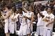 Mar 15, 2014; Katy, TX, USA; Stephen F. Austin Lumberjacks teammates celebrate during the final seconds of the game against the Sam Houston State Bearkats in the championship game for the Southland Conference college basketball tournament at Merrell Cente