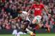 MANCHESTER, ENGLAND - MARCH 16: Raheem Sterling of Liverpool competes with Michael Carrick of Manchester United during the Barclays Premier League match between Manchester United and Liverpool at Old Trafford on March 16, 2014 in Manchester, England. (P