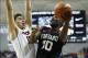 Jan 8, 2014; Storrs, CT, USA; Harvard Crimson forward Kyle Casey (30) shoots against Connecticut Huskies forward Tyler Olander (10) in the second half at Harry A. Gampel Pavilion. UConn defeated Harvard 61-56. Mandatory Credit: David Butler II-USA TODAY S
