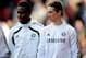 STOKE ON TRENT, ENGLAND - APRIL 02: Fernando Torres of Chelsea heads for the bench as a substitute with team mate John Obi Mikel (L) during the Barclays Premier League match between Stoke City and Chelsea at the Britannia Stadium on April 2, 2011 in Sto