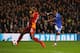 LONDON, ENGLAND - MARCH 18: Samuel Eto'o of Chelsea shoots past Aurelien Chedjou of Galatasaray to score their first goal during the UEFA Champions League Round of 16 second leg match between Chelsea and Galatasaray AS at Stamford Bridge on March 18, 201