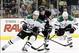 Mar 18, 2014; Pittsburgh, PA, USA; Pittsburgh Penguins center Sidney Crosby (87) chases the puck as Dallas Stars left wing Ryan Garbutt (16) and left wing Antoine Roussel (21) defend during the second period at the CONSOL Energy Center. Mandatory Credit: